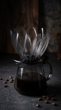 Flower Cone Dripper brewing pour-over coffee on a glass server