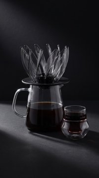 Flower Cone Dripper on a glass server beside a 120ml double-wall glass of black coffee