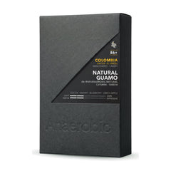 Colombia Natural Guamo 36+96h Anaerobic Natural — 10oz box, front three-quarter view on white